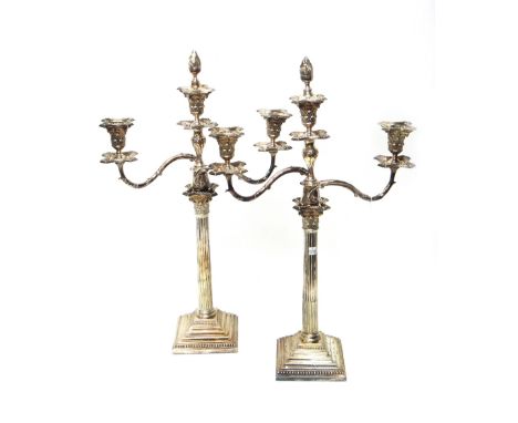 Plated wares, comprising; a pair of three light table candelabra, each formed as a Corinthian column, raised on a stepped squ