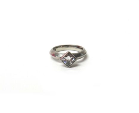 A platinum and diamond set single stone ring, mounted with a princess cut diamond, year 2000, ring size I, gross weight 6.6 g