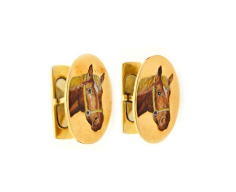 A pair of gold and enamelled cufflinks, the oval fronts enamelled with a horses head, the backs with folding sprung fittings,