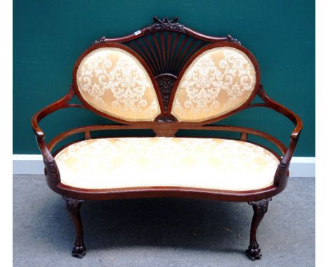 An Edwardian inlaid mahogany peacock back show frame sofa, with carved flaming torch crest on knurll feet, 129cm wide x 104cm