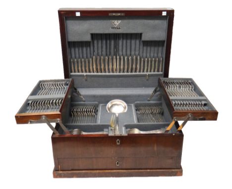 A European table service of flatware, comprising; twelve large steel bladed table knives, twelve small steel bladed cheese kn