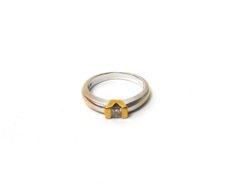 An 18ct two colour gold and diamond set single stone ring, mounted with a princess cut diamond, ring size L and a half, with 