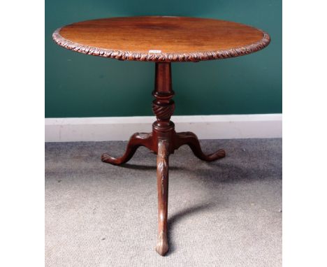 A George III mahogany circular snap top tripod occasional table, with carved decoration, 80cm wide x 72cm high.