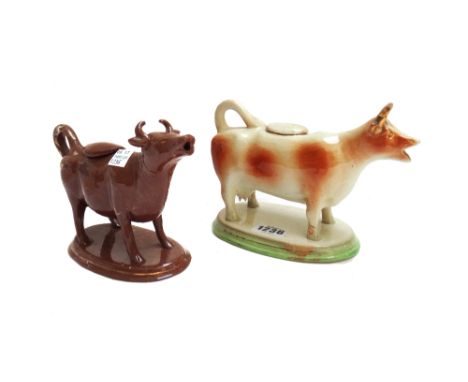 Ten 19th century pottery cow creamers, including; blue and white 'Willow' pattern, brown sponge decorated, a Sunderland lustr