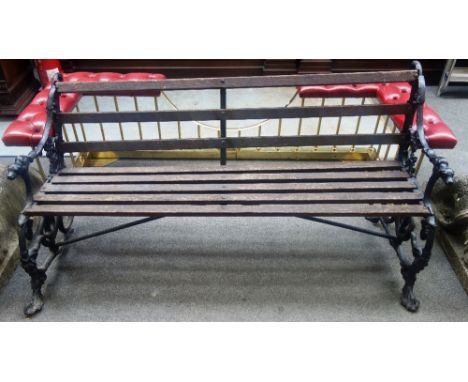 Probably Coalbrookdale; a black painted cast iron garden bench, relief cast with dog, grape and serpent, 158cm wide x 78cm hi