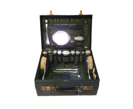 A lady's silver mounted travelling fitted dressing case, the fittings including; a spirit flask with a pull-off beaker base, 