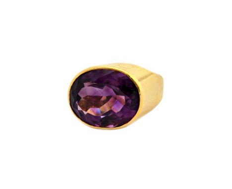 An 18ct gold and amethyst single stone ring by Theo Fennell, collet set with an oval cut amethyst, ring size K and a half, gr