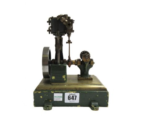 A scale model steam engine, possibly 'Stuart', with vertical piston and spoked fly wheel, on a stepped rectangular base, 16cm