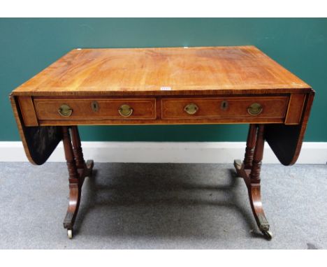 A Regency line inlaid mahogany sofa table, with a pair of frieze drawers on turned columns and four down swept supports, 68cm