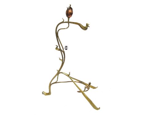 An Art Nouveau brass and copper mounted table easel (converted), with foliate finial and scroll body, 46.5cm high.