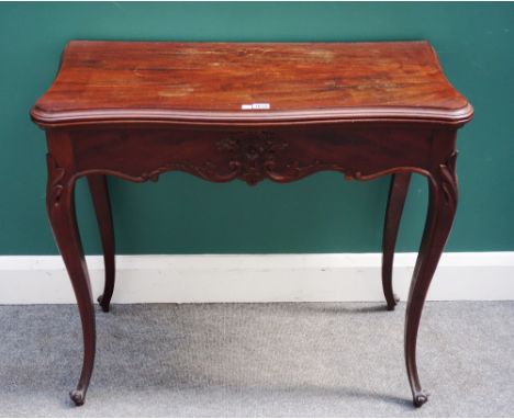 A mid-19th century French mahogany serpentine foldover card table, on cabriole supports, 85cm wide x 42cm deep.