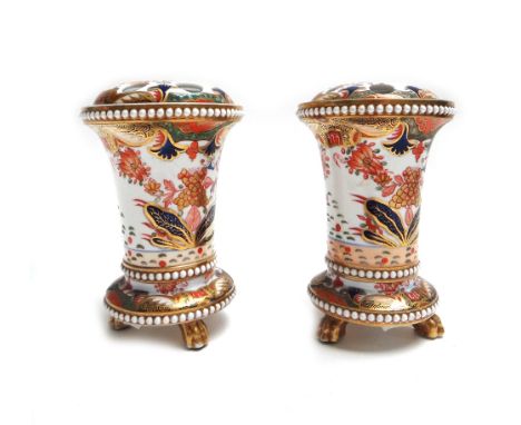 A near pair of Spode porcelain `967' vases and matched covers, early 19th century, raised on three gilt paw feet, red painted