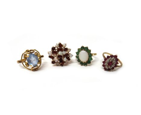 A 9ct gold, opal and garnet set cluster ring, a 9ct gold, opal and emerald set oval cluster ring, a 9ct gold, ruby and diamon