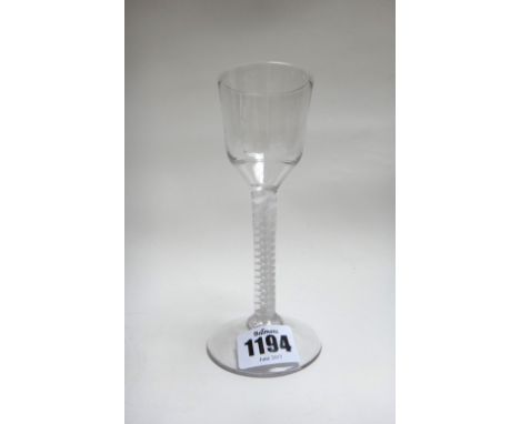 An opaque twist wine glass, circa 1765, the ogee bowl raised on a double series opaque twist stem and plain foot, 14.5cm. hig