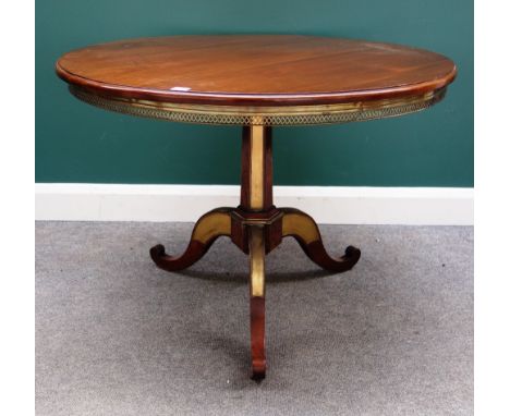 An early 19th century Baltic States brass mounted mahogany tripod occasional table, 98cm diameter x 71cm high.