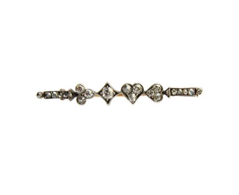 A diamond brooch, designed as a row of the four playing card suits, comprising; clubs, diamonds, hearts and spades, mounted w