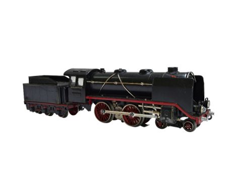 An 'O' gauge vintage Marklin electric steam locomotive (E66/12920) 4-4-0 with tender (E929/0), with one large dark blue Wagon