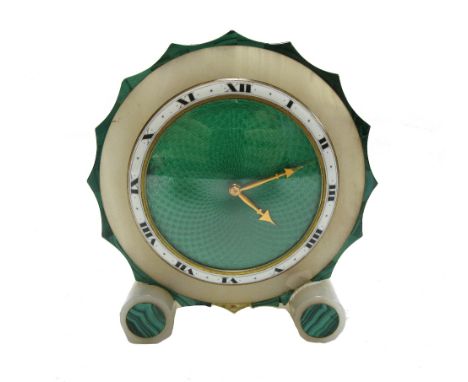 An Art Deco eight day alabaster mantel timepiece of circular shaped form, with green enamel dial and malachite inlay (a.f), 1
