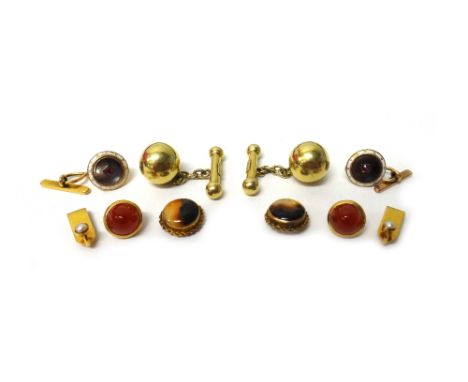 A pair of gold cufflinks, having spherical fronts and with dumb bell bar fittings at the backs, detailed KHI 18, a pair of go