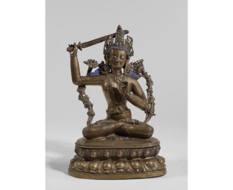 STATUE DE MANJUSHRI EN ALLIAGE DE CUIVRETIBET, XIVE SIÈCLEHimalayan Art Resources item no. 4841 28.5 cm (11 1/4 in.) high Foo