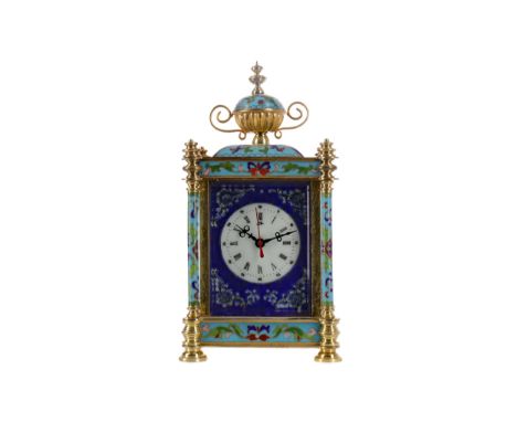 REPRODUCTION ORMOLU AND CHAMPLEVE ENAMEL MANTEL CLOCK, with single train movement, the white enamel dial with Roman and Arabi
