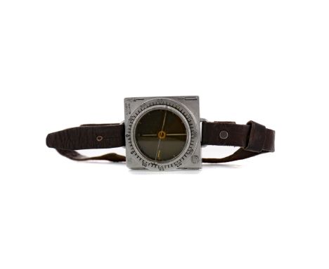 VINTAGE SUUNTO WRIST COMPASS, the dial 4cm diameter, on a leather strap