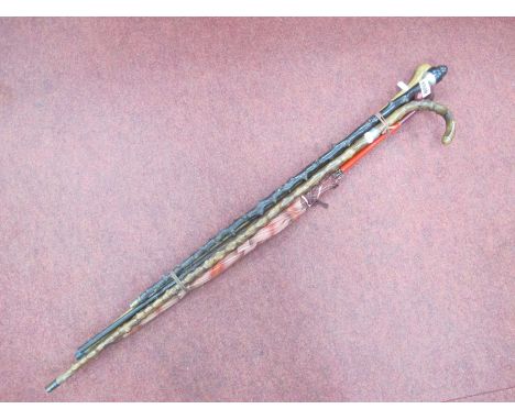 A Silver Handled Acorn Shaped Walking Stick, three other walking sticks and a vintage umbrella.