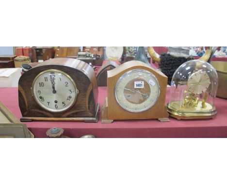 A XX Century Oak Cases Musical Mantle Clock, oak cased eight day mantle clock, and a mantle clock under a glass dome. (3)