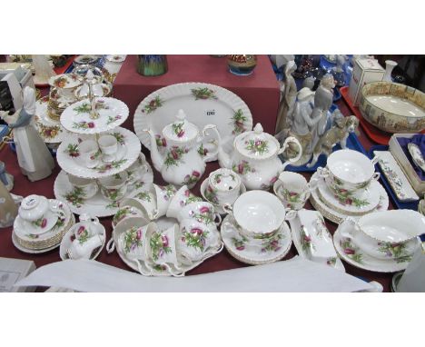 Royal Albert 'Highland Thistle' Table Ware, of approximately fifty six pieces, including teapot, coffee pot, three tier cake 