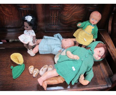 Rosebud Doll, in light blue clothing, rubber doll, larger, and black girl dolls. (4)