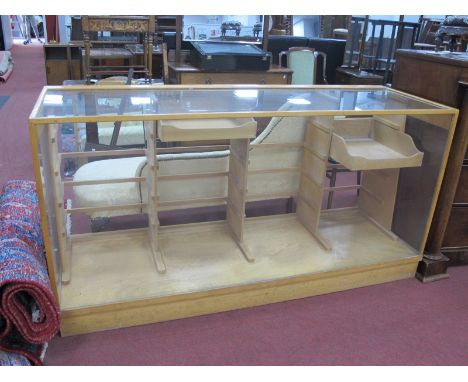 A Light Wood Shops Haberdashery Cabinet, with glazed top, front and sides, sectioned compartments to back housing, two drawer