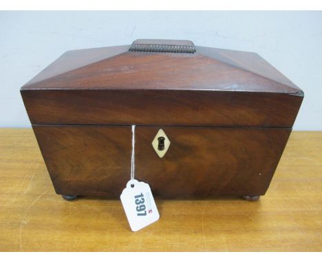 A XIX Century Mahogany Tea Caddy, of sarcophagus form, with internal twin lidded compartments, on four bun feet, top 23.5cm w