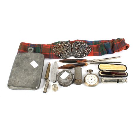 An assortment of collectables. Including a silver nurse's belt buckle, Scouts whistle, silver thimble, pocket watch, large hi