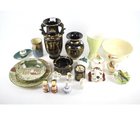 An assortment of ceramics. Including a Poole vase, Royal Doulton vase and bowl, a pair of Guiness Toucans, etc