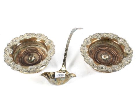 Two decorative silver plated wine coasters and an EPNS ladle. All with moulded details