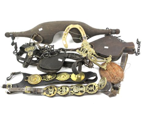 An assortment of horse brasses and other items. Also including a 'Fishleigh patent rotary cultivator' metal plaque, bellows, 