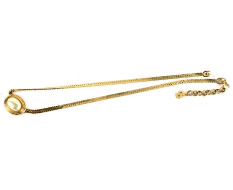 A Christian Dior gilt necklace. Set with a simulated pearl, marked 'Chr Dior, Germany'