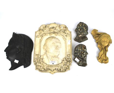 An assortment of ceramic and cast metal profiles of historic individuals. Including a plaque featuring Gladstone, H32cm