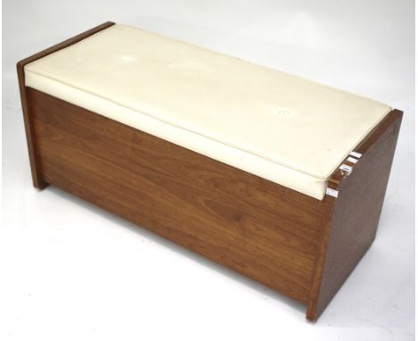 A mid-century teak storage bench. The hinged top with padded seat, all raised on casters. L97cm x circa D47cm x H44cm