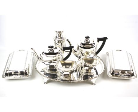 A quantity of silver plated items. Including Elkington &amp; Co silver plated oval tray on four feet, silver plated cocktail 