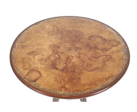 A Georgian mahogany circular tilt top occasional table. With tooled leather insert to the top, raised on a turned column to a