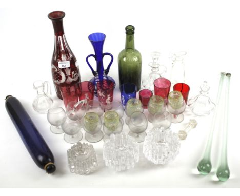 An assortment of glassware. To include a blue glass rolling pin, pair of cranberry glass Mary Gregory beakers, etc