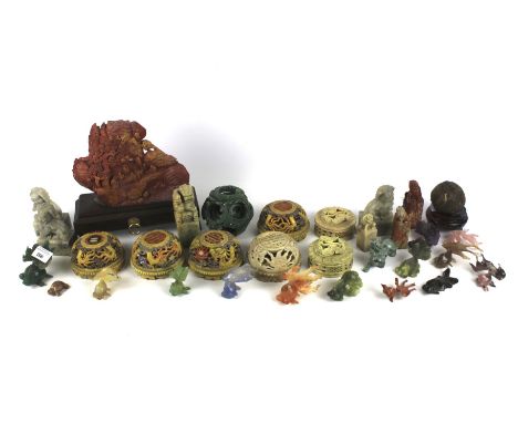 A collection of Chinese carved soapstone and stone ornaments. Including hardstone figures of goldfish, dogs of fo seal chops,