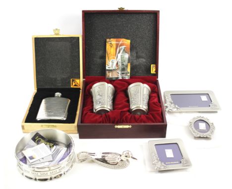 An assortment of pewter wares. To include a Royal Selangor hip flask, in original box, wine bottle coaster, pair of four seas