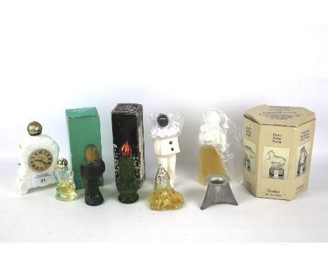 A collection of perfume bottles. Including examples by Avon and bottles modelled as birds and a clock, together with a boxed 