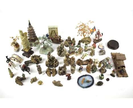 An assortment of Chinese miniature pottery figures. Including soapstone and ceramic examples, some glazed