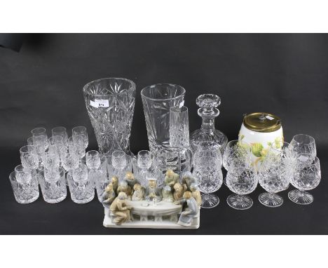 An assortment of glassware. Including a decanter, vases and multiple wine glasses and beakers, some with moulded decoration, 