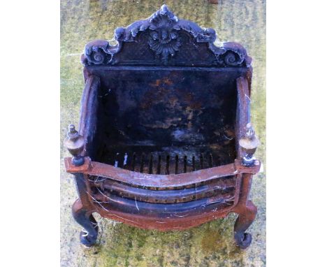 A cast iron fire grate. With urn finials, measuring 63cm high