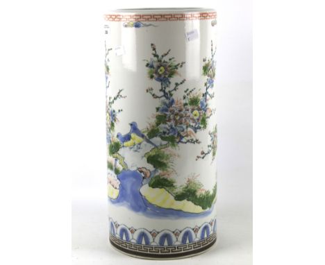 A large cylindrical Japanese ceramic vase or umbrella stand. Decorated with scenes of birds by a waterway amongst foliage, 46