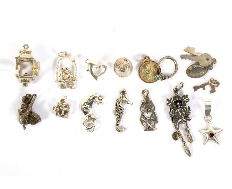 Fifteen silver and white metal charms. Modelled as animals, a lantern, bible, etc, 21.2g